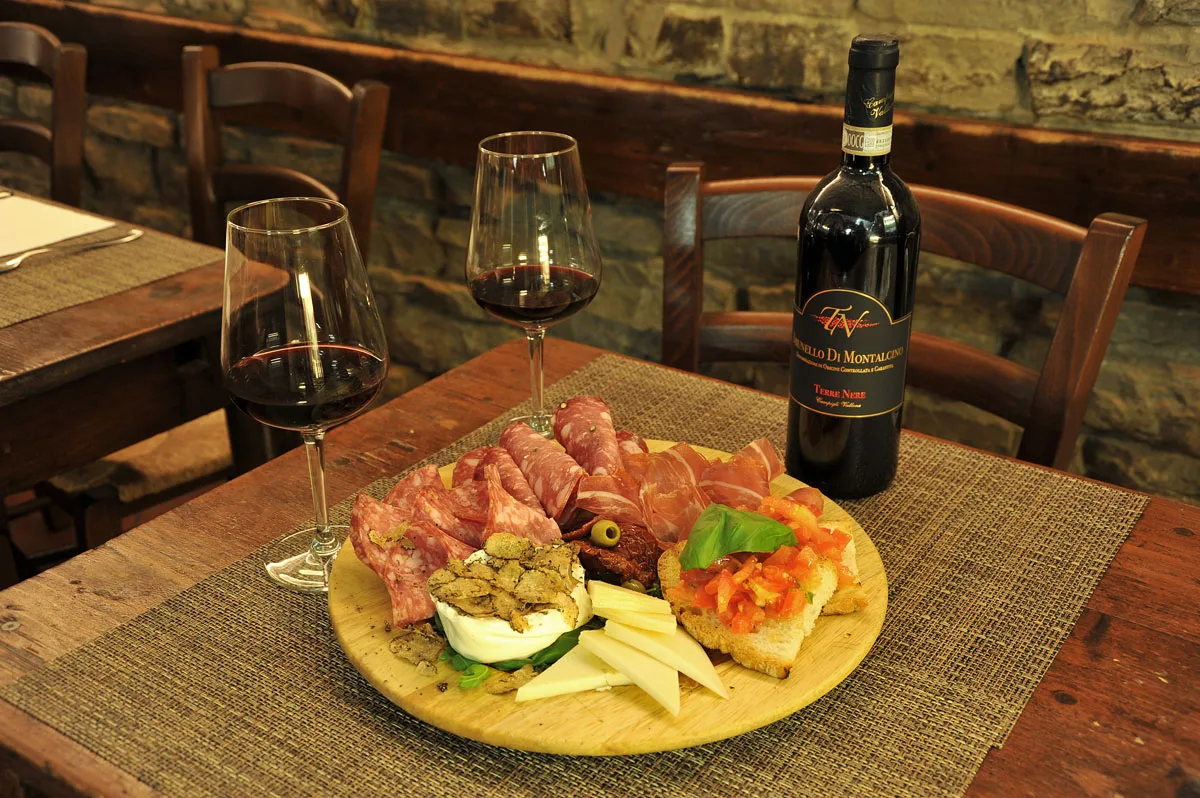 Cured meats, cheese and crostini with a red wine from Montalcino.
