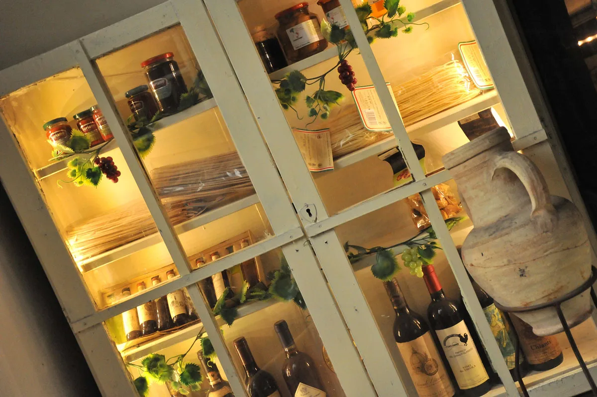 Wines and preserves in the osteria’s display cabinet.